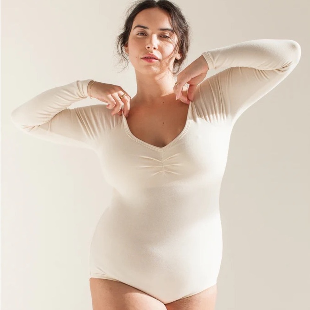 ARQ leotard in size S, cream color
